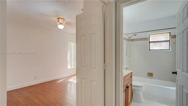 a bathroom with a bathtub and a toilet