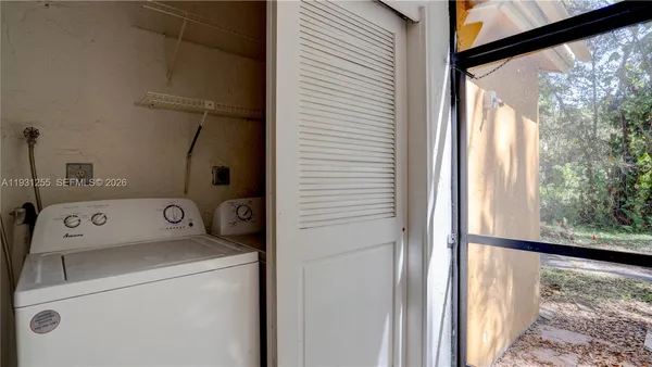 a utility room with dryer and washer