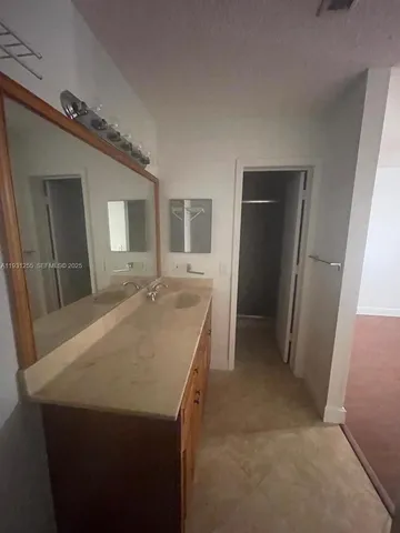 view of a bathroom with sink and mirror