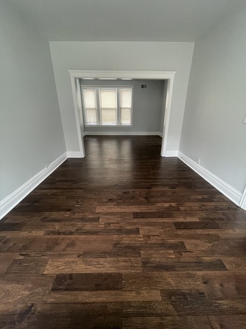 916 West 68th Street, Unit 2W Chicago, IL 60621 - Photo 4 of 8 a view of empty room with wooden floor