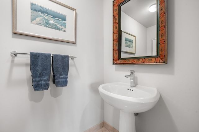 a bathroom with a sink and mirror