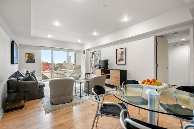 a workspace with furniture and a wooden floor