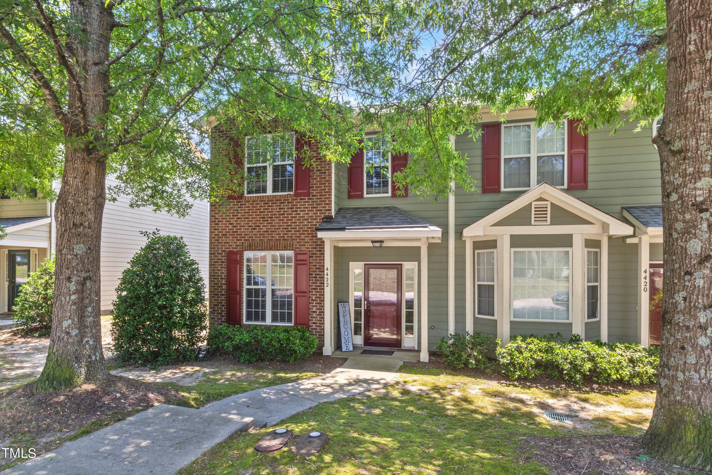 4422 Pottery Lane Raleigh, NC 27616 - Photo 1 of 1 a front view of a house with garden