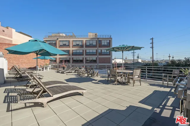 a view of a patio with swimming pool