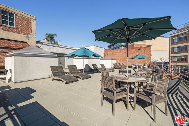 a view of balcony with wooden floor