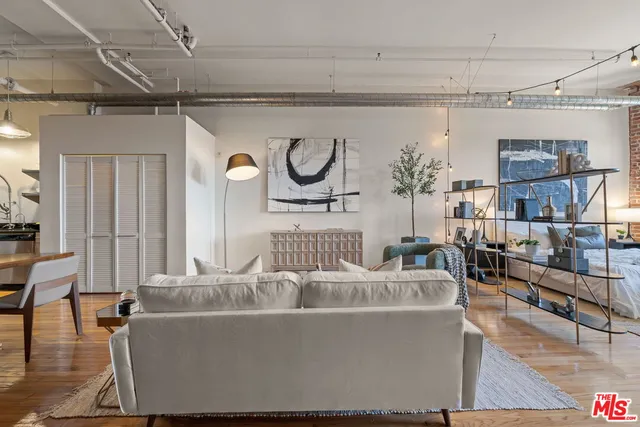 a living room with furniture and a table