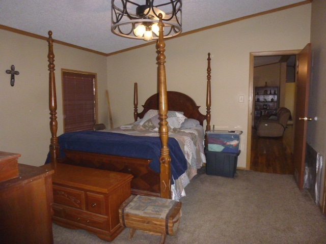 6009 Park Road Clinton, IL 61727 - Photo 6 of 15 a bed room with a bed window and a mirror