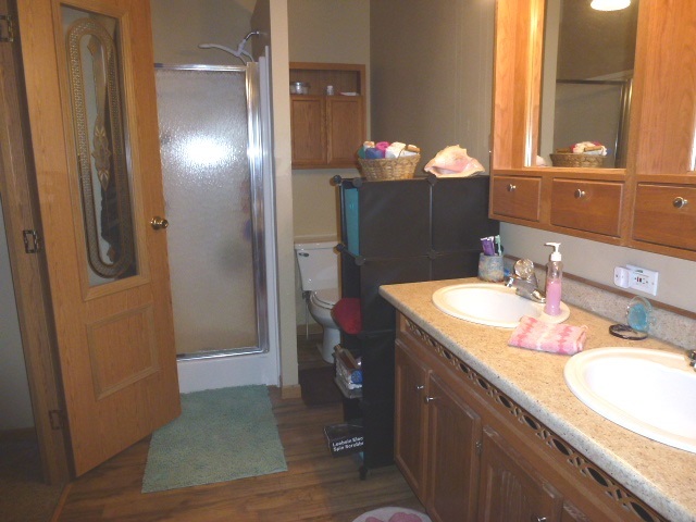 6009 Park Road Clinton, IL 61727 - Photo 8 of 15 a bathroom with a granite countertop sink and a mirror