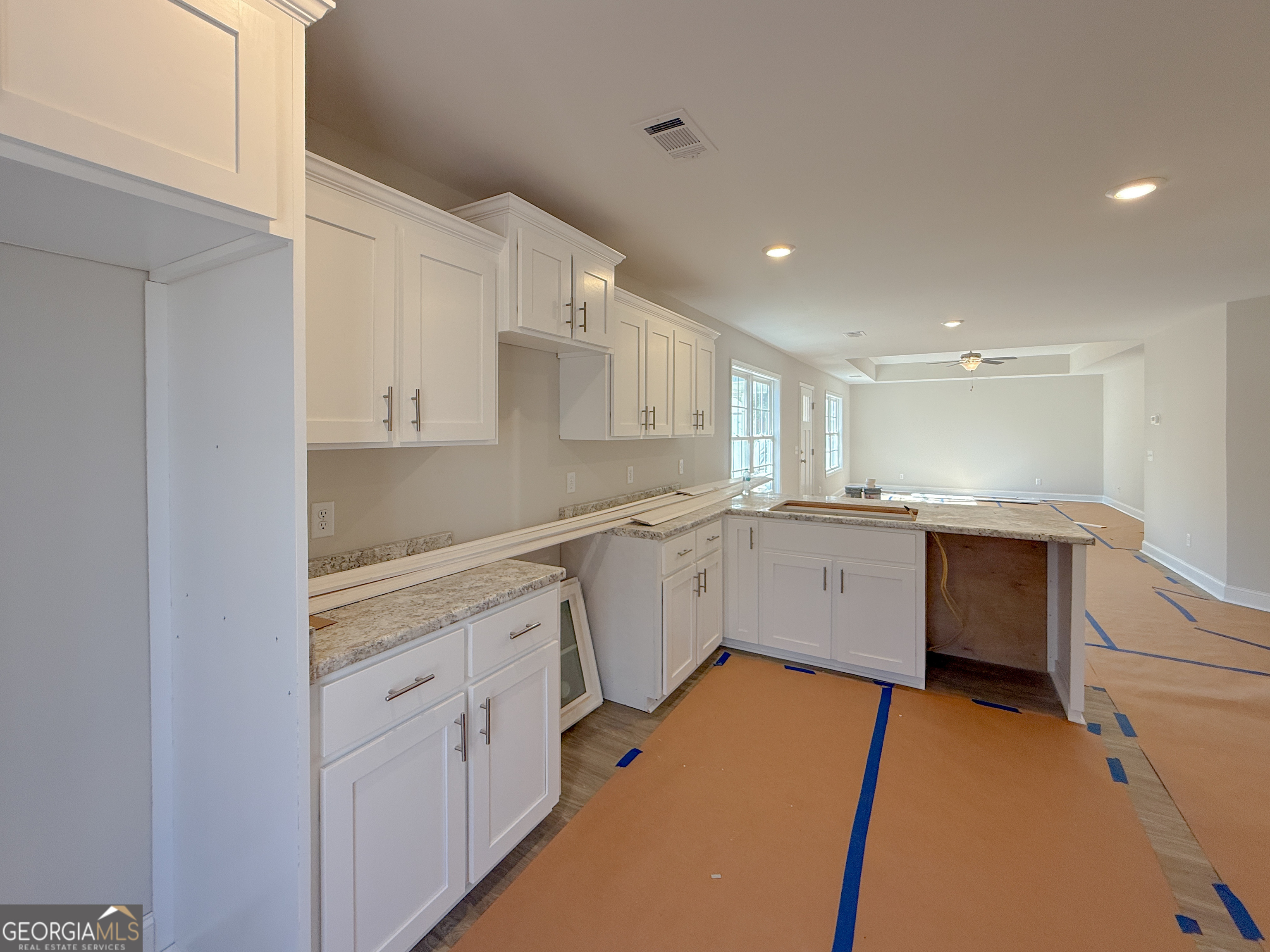 3156 Sterling Road Claxton, GA 30417 - Photo 11 of 22 a kitchen with white cabinets appliances and a sink