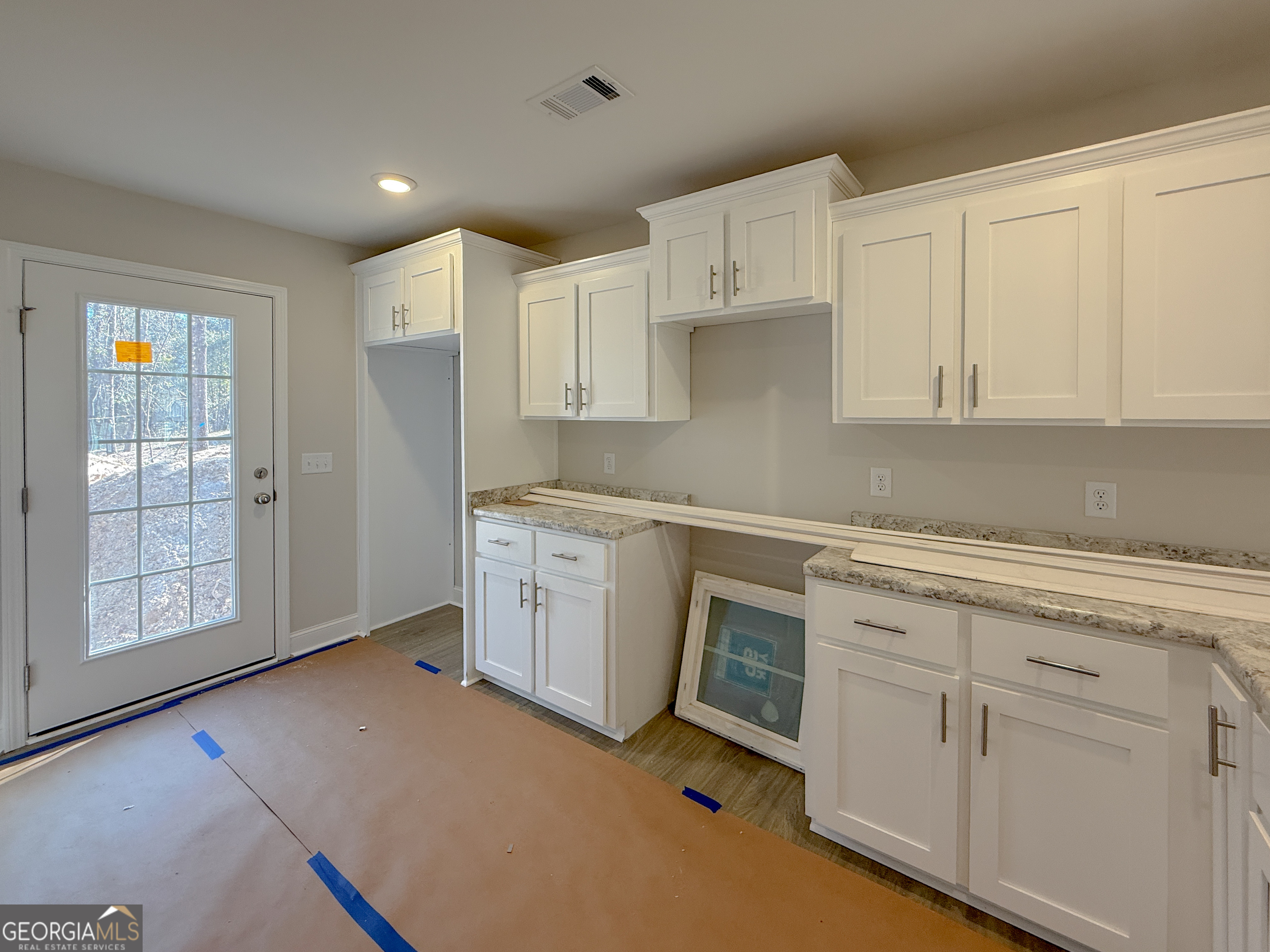 3156 Sterling Road Claxton, GA 30417 - Photo 14 of 22 a kitchen with white cabinets and white appliances