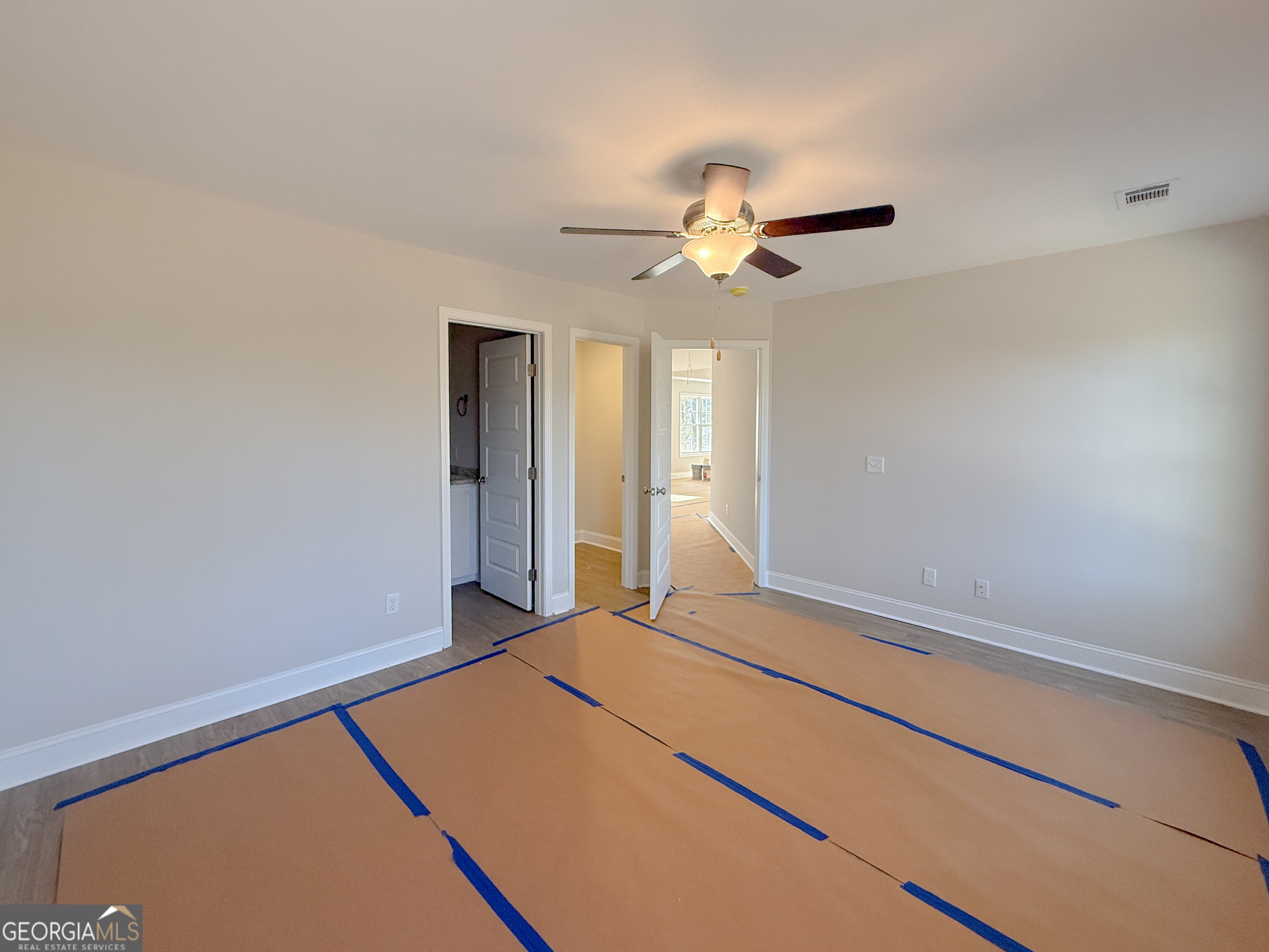3156 Sterling Road Claxton, GA 30417 - Photo 21 of 22 a bedroom with a bed and a ceiling fan