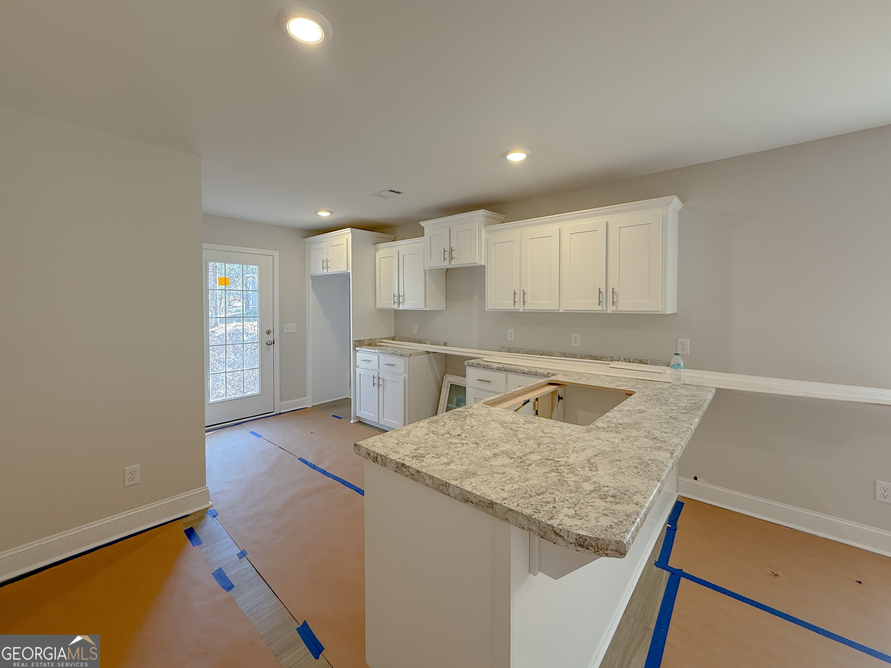 3156 Sterling Road Claxton, GA 30417 - Photo 9 of 22 a kitchen with granite countertop a sink stainless steel appliances and cabinets