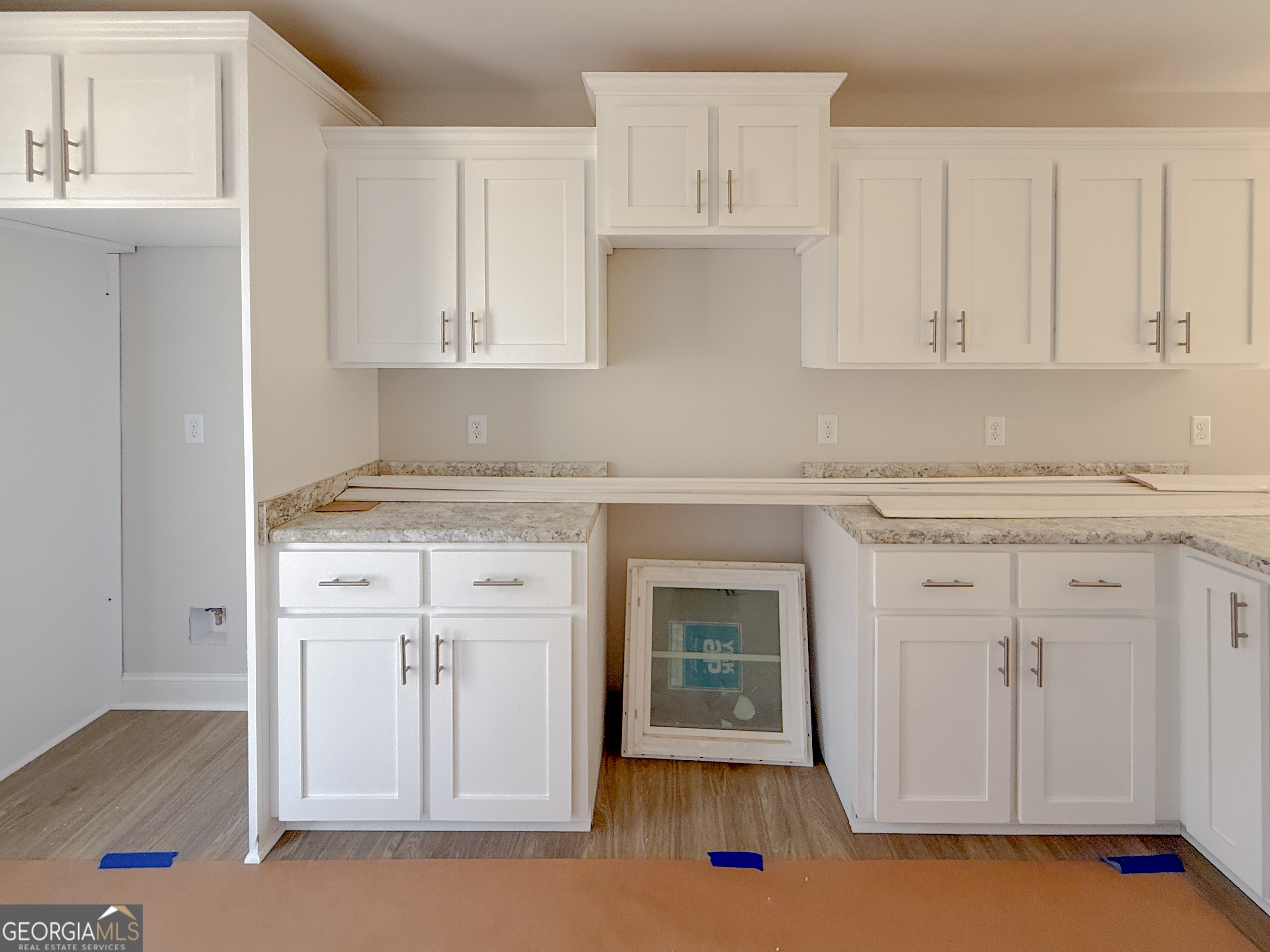 3156 Sterling Road Claxton, GA 30417 - Photo 10 of 22 a kitchen with white cabinets