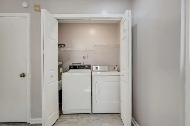 a view of storage and utility room with washer and dryer