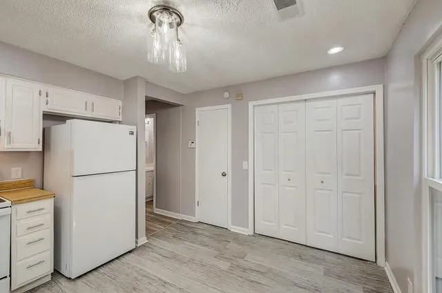 a view of a livingroom with a refrigerator