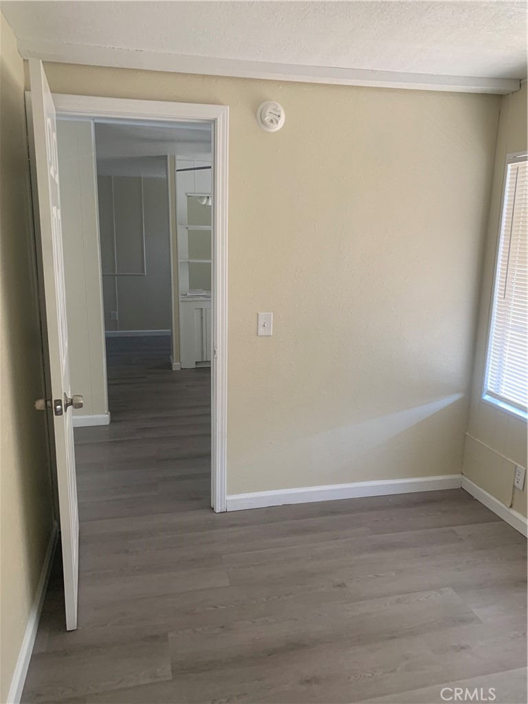2865 West Rialto Avenue, Unit 2 Rialto, CA 92376 - Photo 5 of 19 wooden floor in an empty room