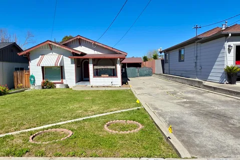 a swimming pool with patio outdoor seating and yard