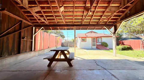 a view of yard with patio