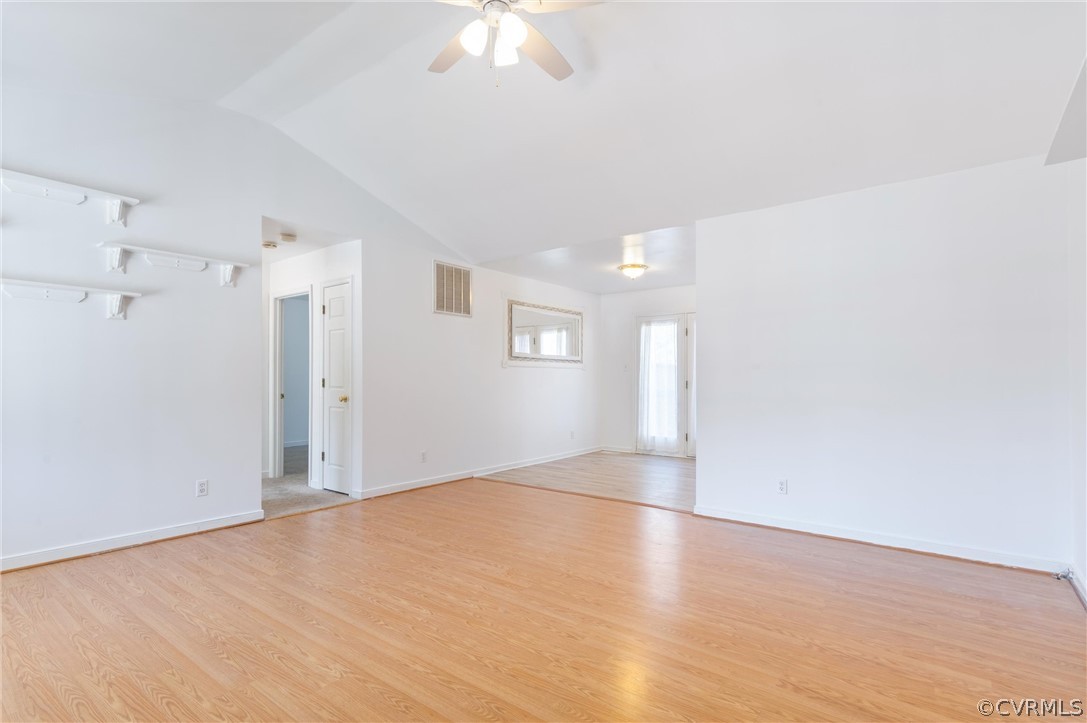 19606 Trumpeter Road Petersburg, VA 23803 - Photo 3 of 22 a view of empty room with wooden floor and fan