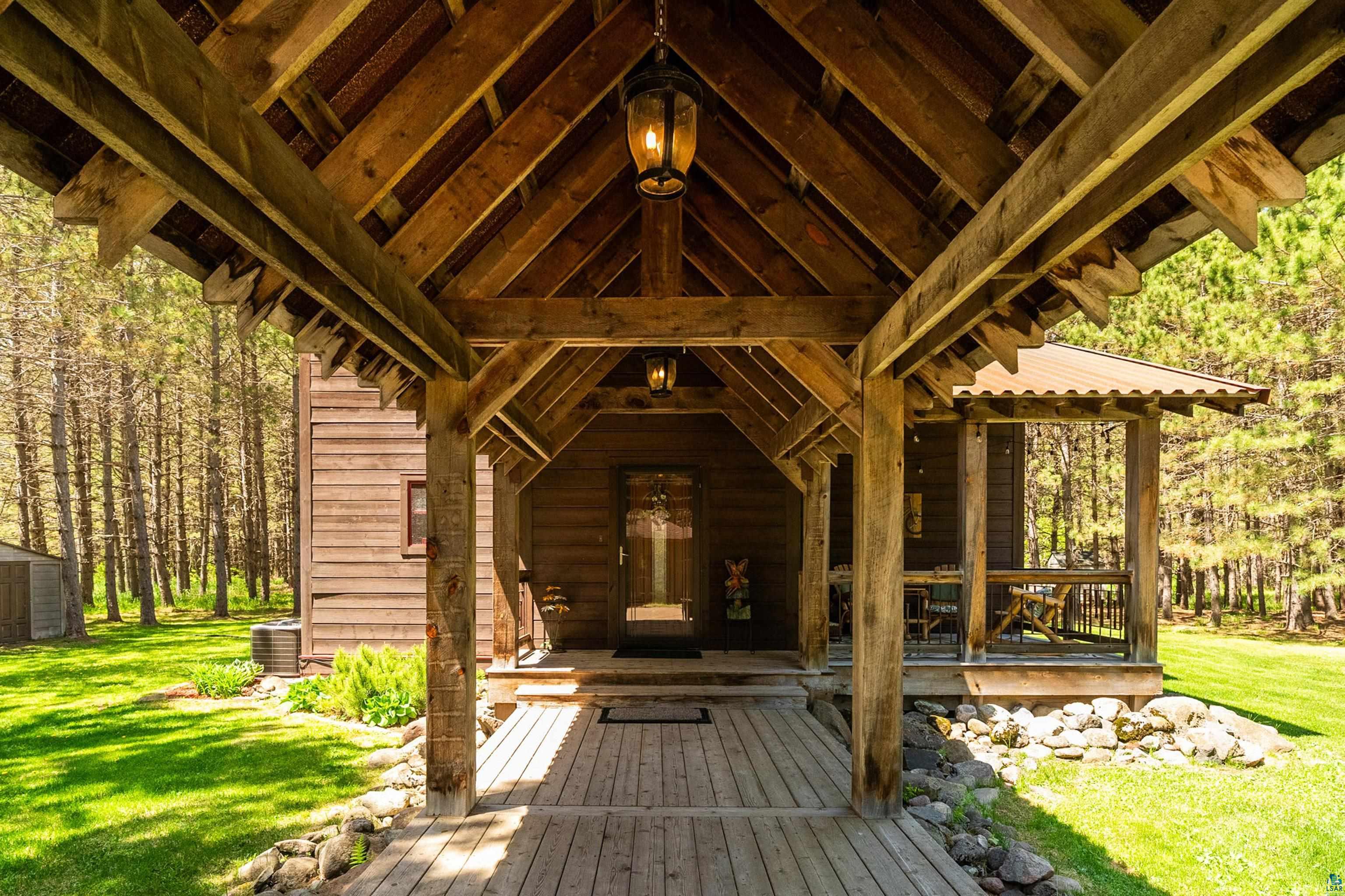 75 East Stark Road Esko, MN 55733 - Photo 57 of 87 Wood-finish covered entryway with exposed beams and a planked deck