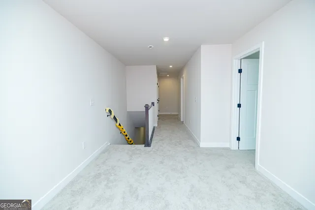 a view of a livingroom with a ceiling fan and window