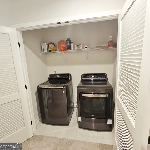 an empty room with a window and ceiling fan