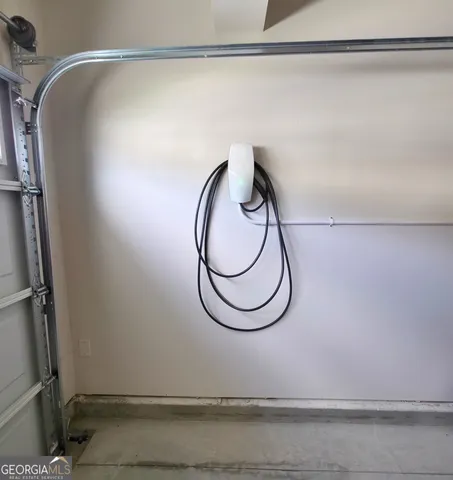 a view of a water fountain with wooden fence