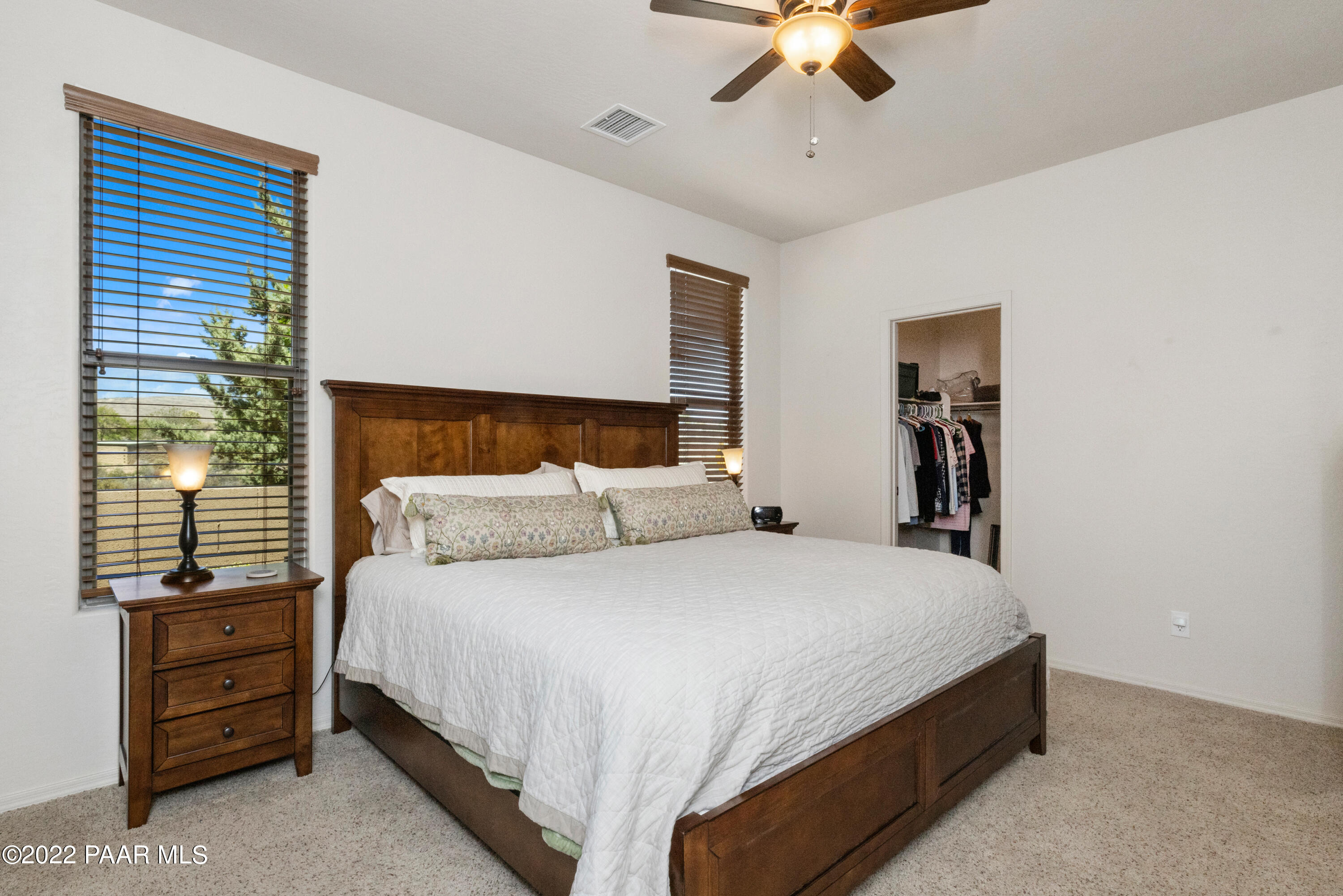 7226 Woolsey Ranch Road Prescott Valley, AZ 86314 - Photo 12 of 30 a bedroom with a bed and a ceiling fan
