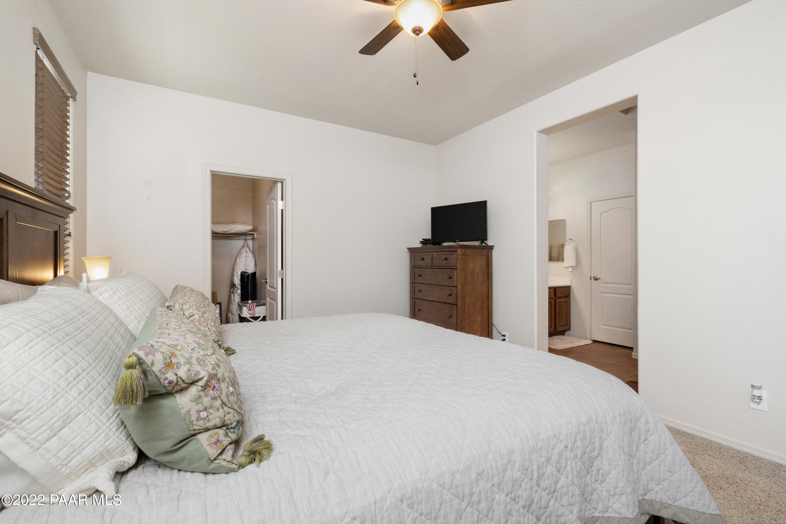 7226 Woolsey Ranch Road Prescott Valley, AZ 86314 - Photo 13 of 30 a bedroom with a bed and a television