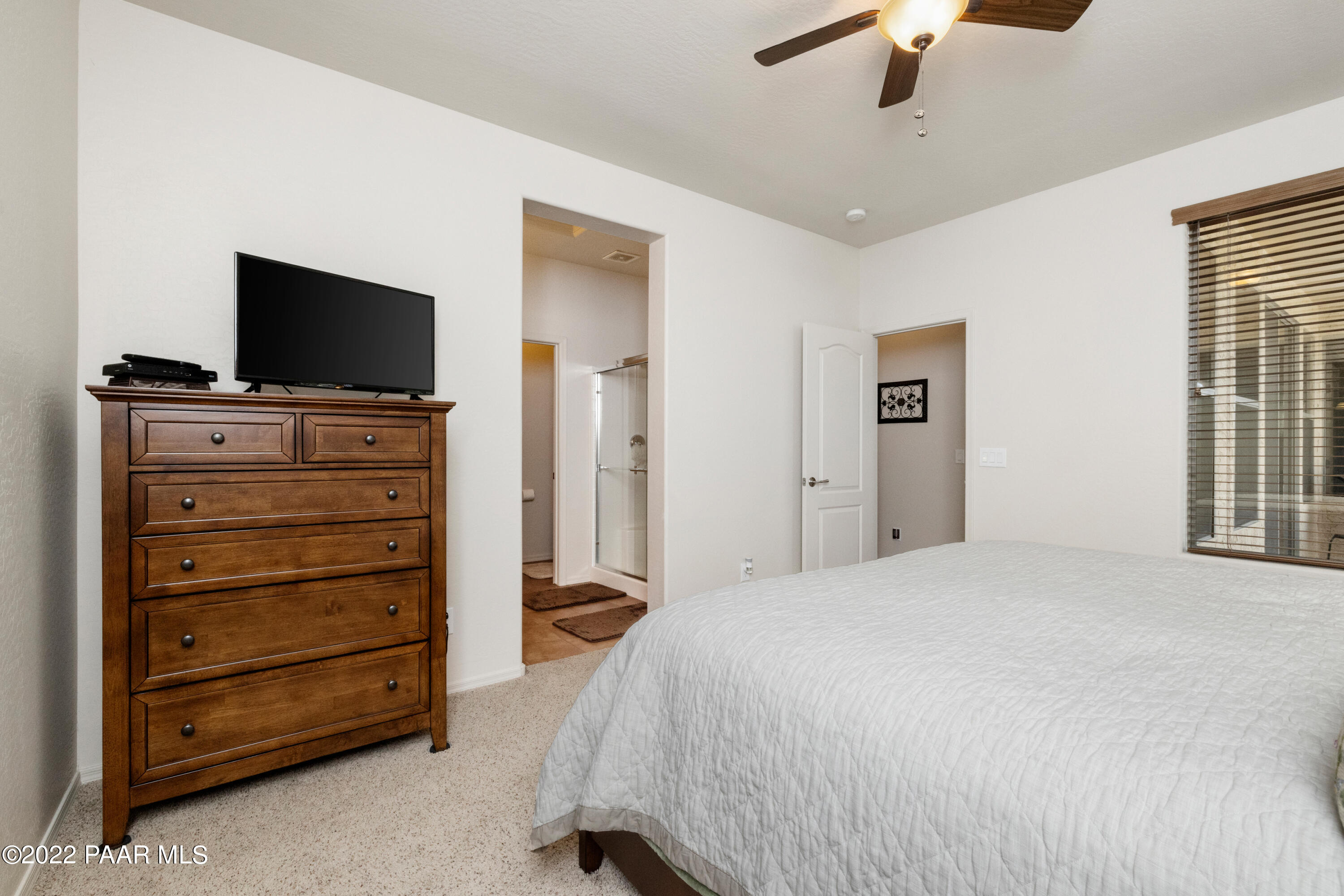 7226 Woolsey Ranch Road Prescott Valley, AZ 86314 - Photo 14 of 30 a bedroom with a bed and a television