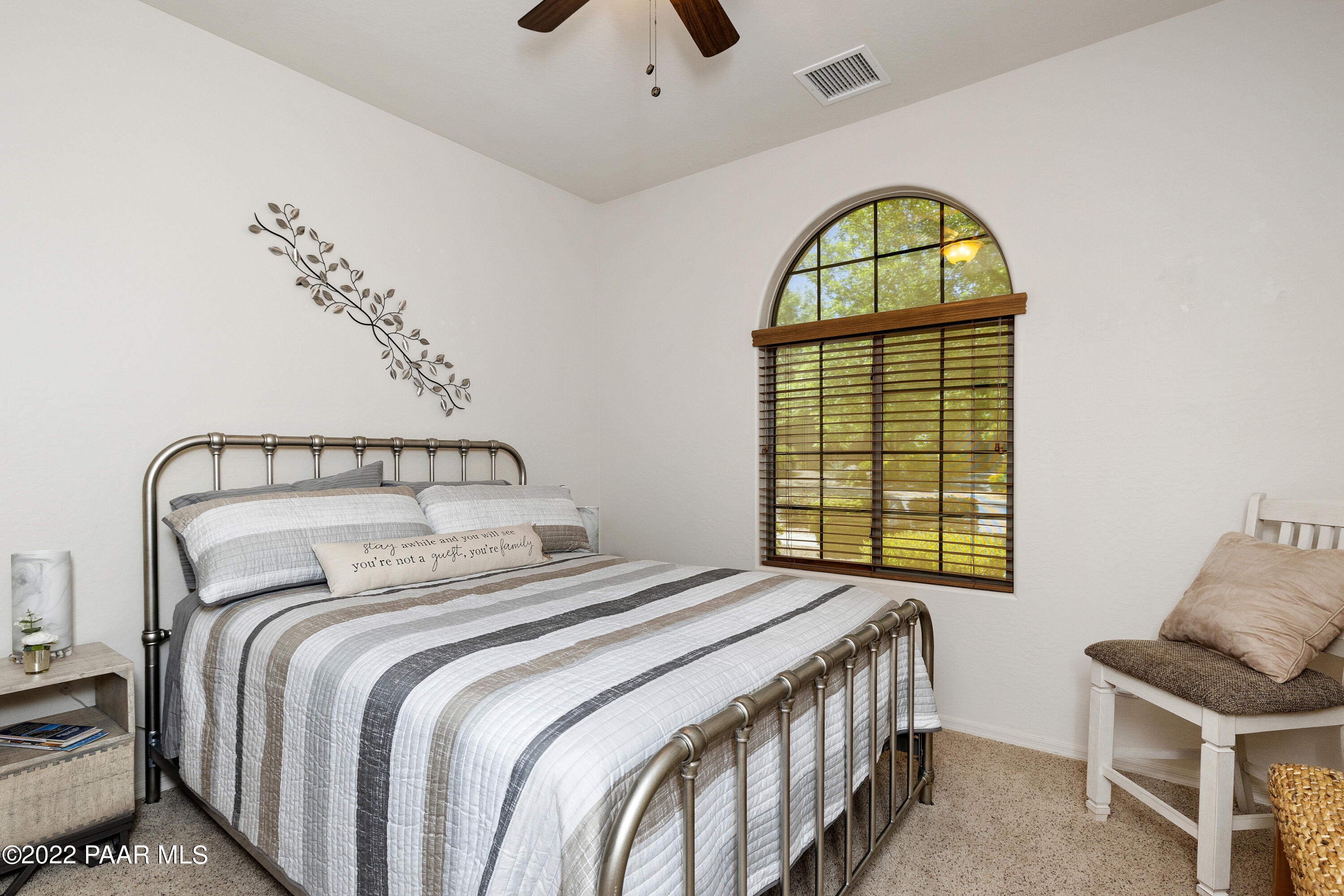 7226 Woolsey Ranch Road Prescott Valley, AZ 86314 - Photo 17 of 30 a bedroom with a bed and a window