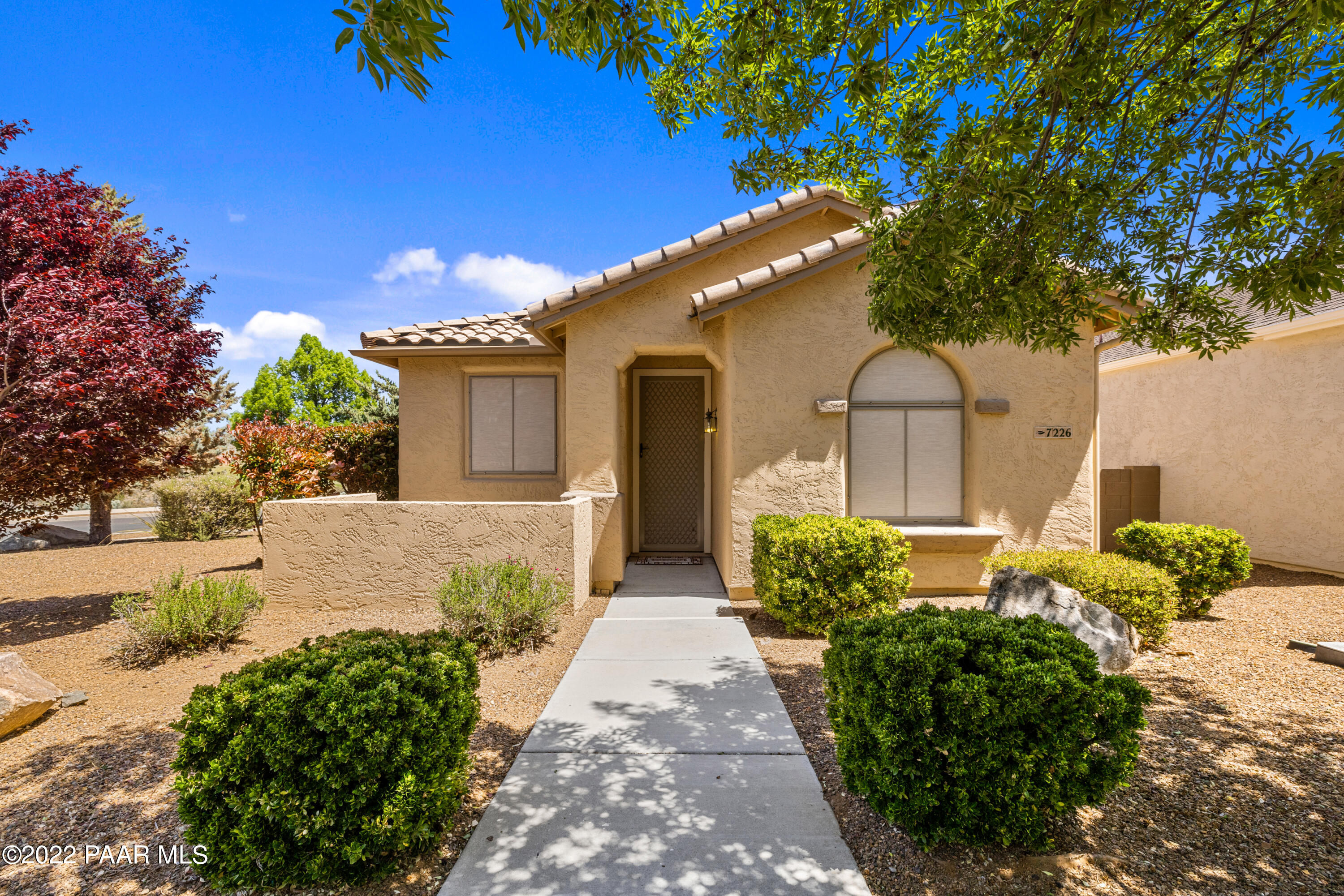 7226 Woolsey Ranch Road Prescott Valley, AZ 86314 - Photo 2 of 30 a front view of a house with a yard
