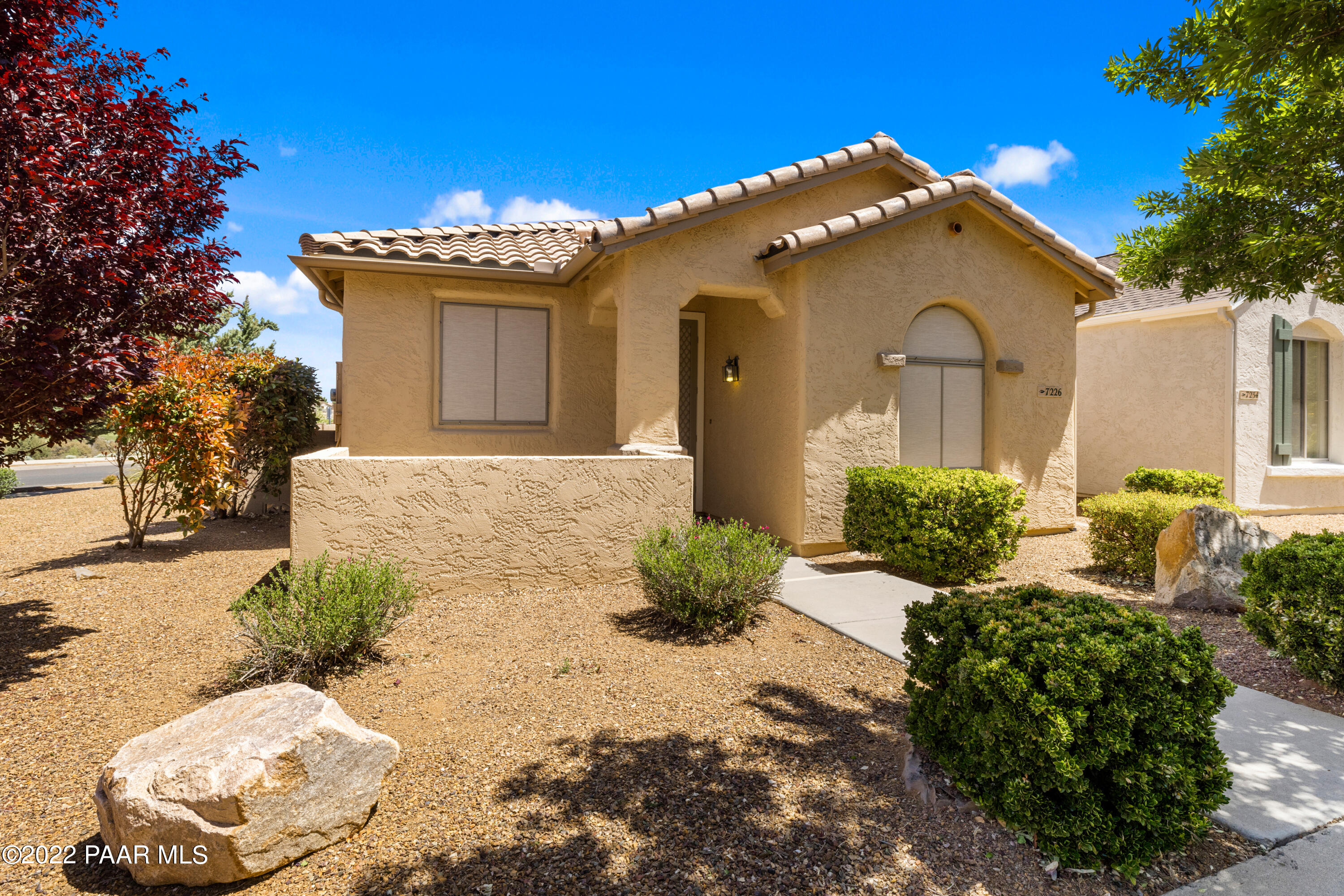 7226 Woolsey Ranch Road Prescott Valley, AZ 86314 - Photo 3 of 30 a front view of a house with a yard