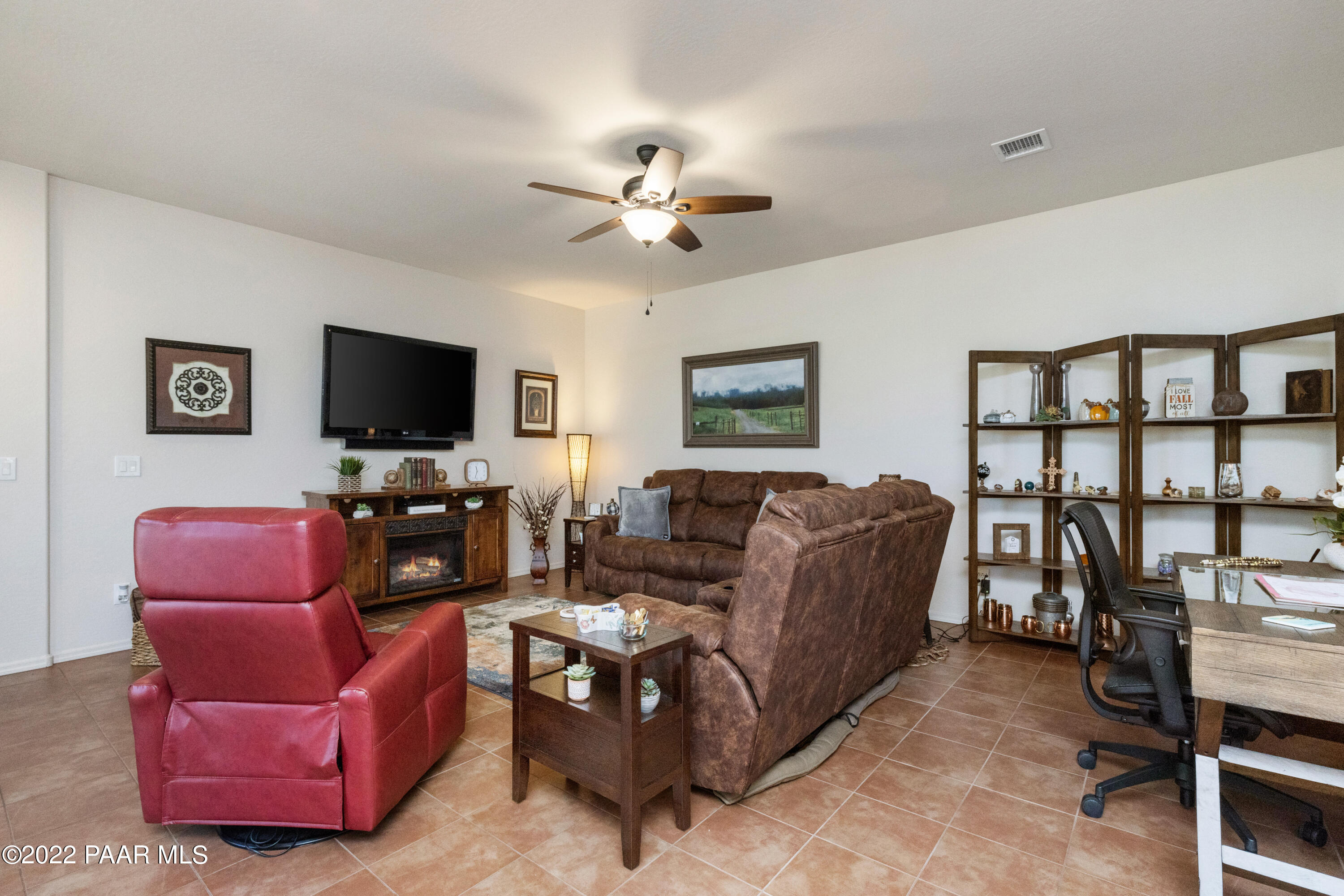 7226 Woolsey Ranch Road Prescott Valley, AZ 86314 - Photo 5 of 30 a living room with furniture and a flat screen tv