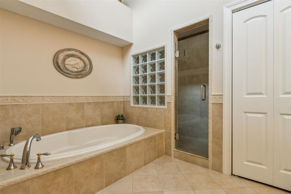 3119 Sea Marsh Road Fernandina Beach, FL 32034 - Photo 31 of 41 a bathroom with a tub and a shower