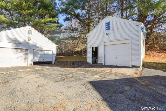 a view of garage and yard