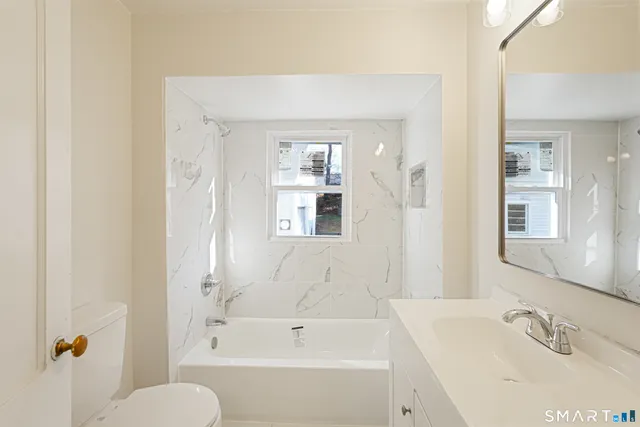 a bathroom with a sink and a bathtub