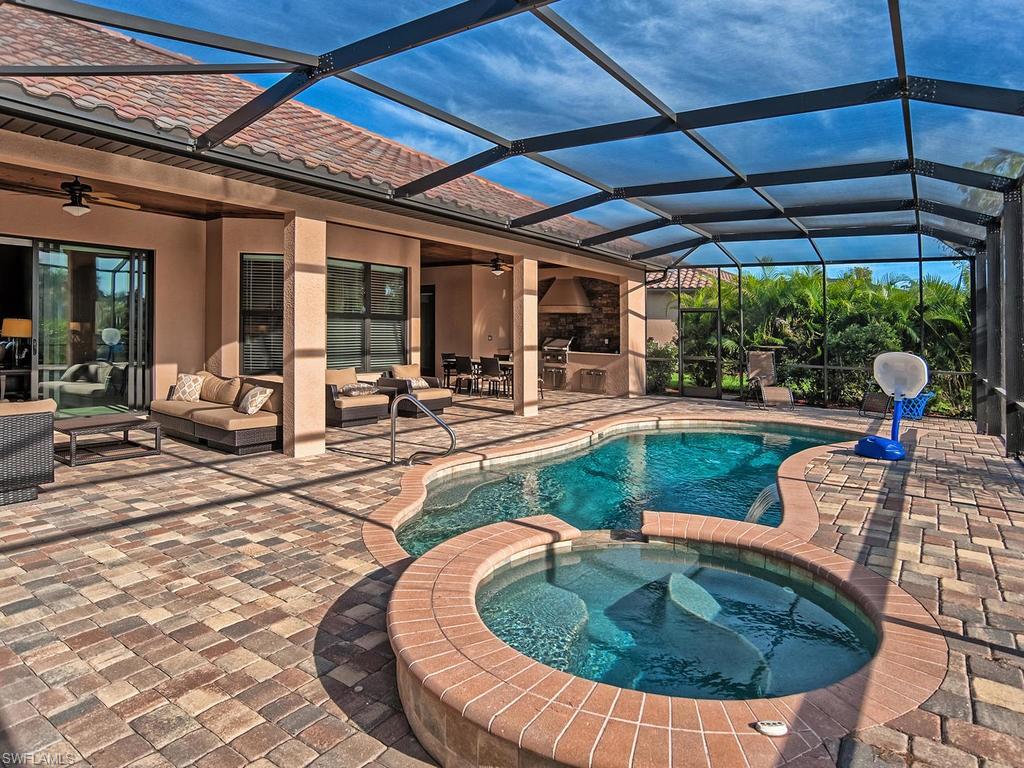 9634 Firenze Circle Naples, FL 34113 - Photo 24 of 35 a view of a house with backyard sitting area and furniture