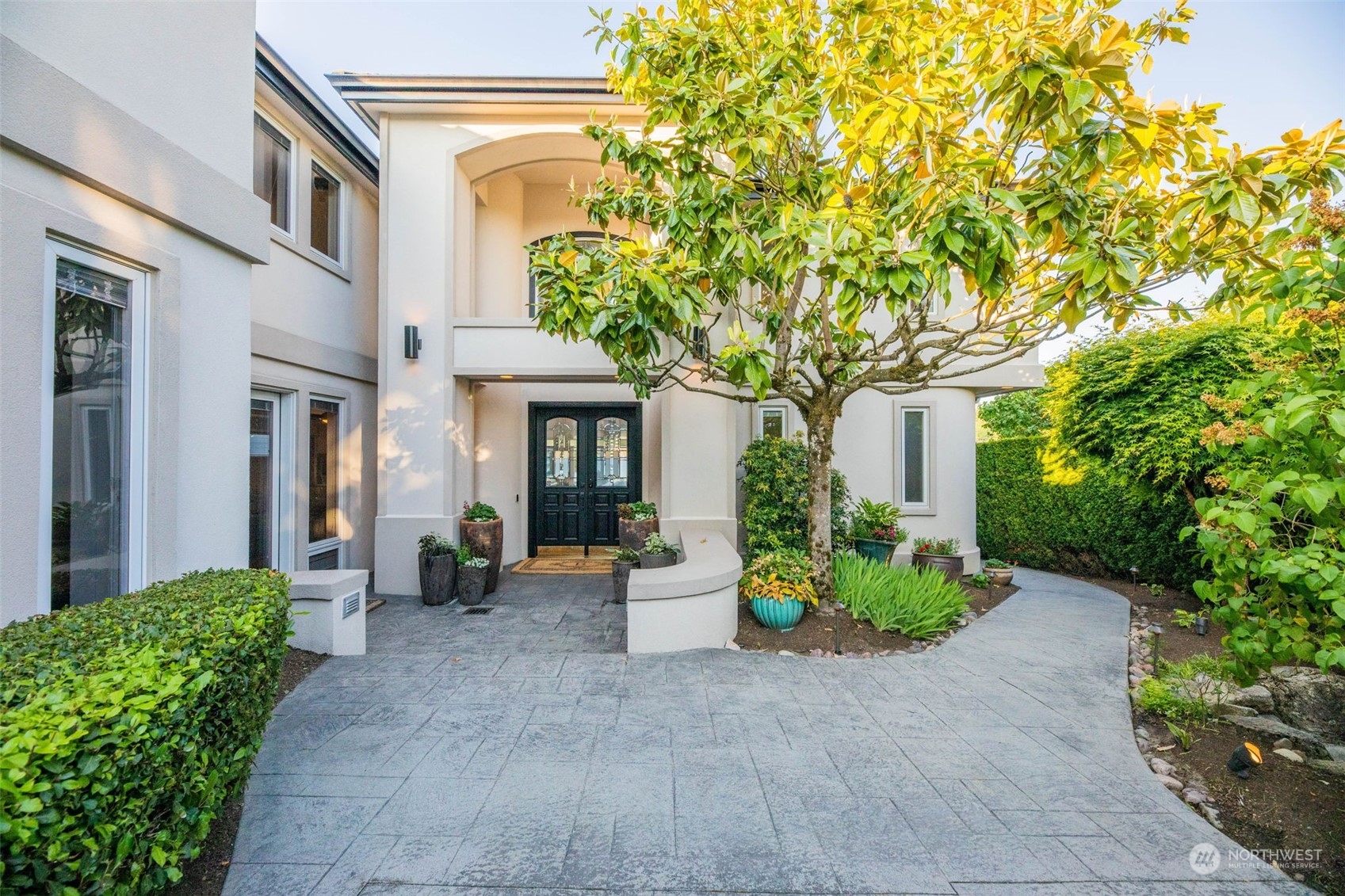 809 Stitch Road Lake Stevens, WA 98258 - Photo 14 of 40 a view of a house with potted plants and a large tree