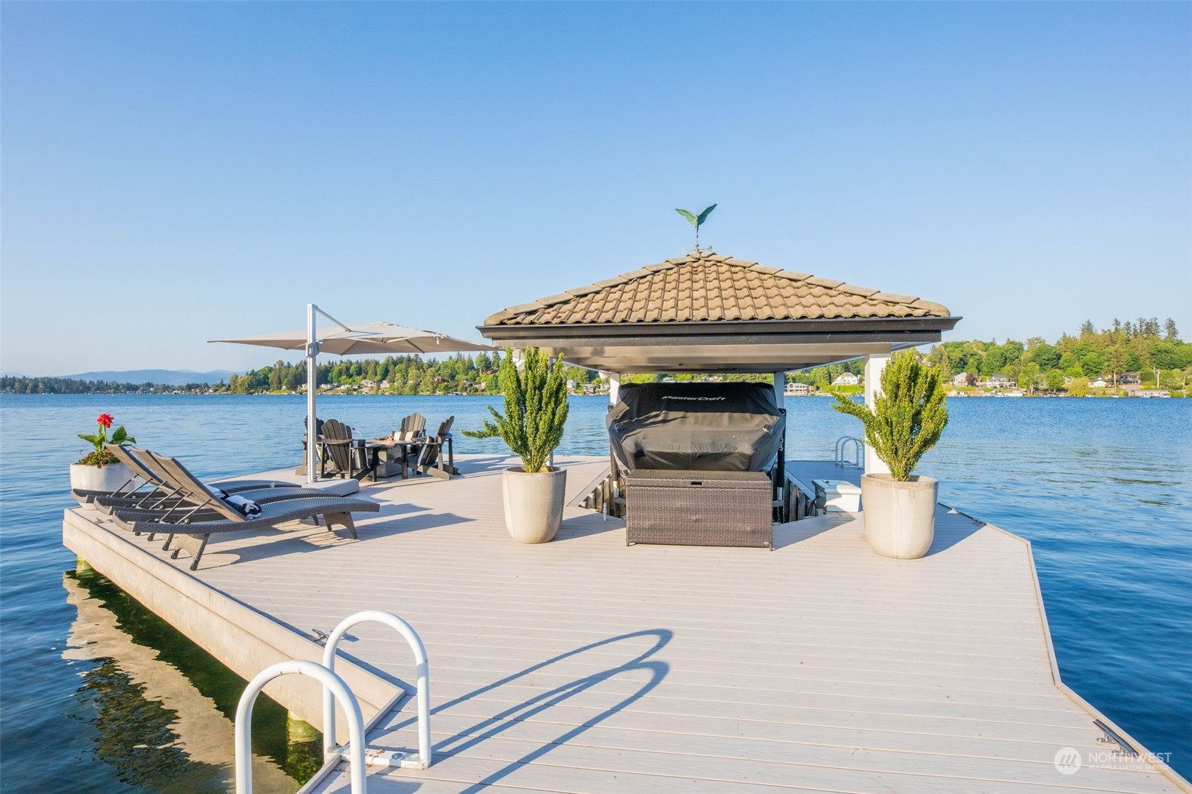 809 Stitch Road Lake Stevens, WA 98258 - Photo 3 of 40 a view of a patio with a table and chairs under an umbrella