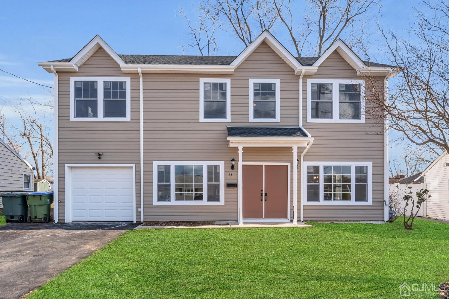 12 Fairfax Road Edison, NJ 08817 - Photo 1 of 30 a front view of a house with a garden
