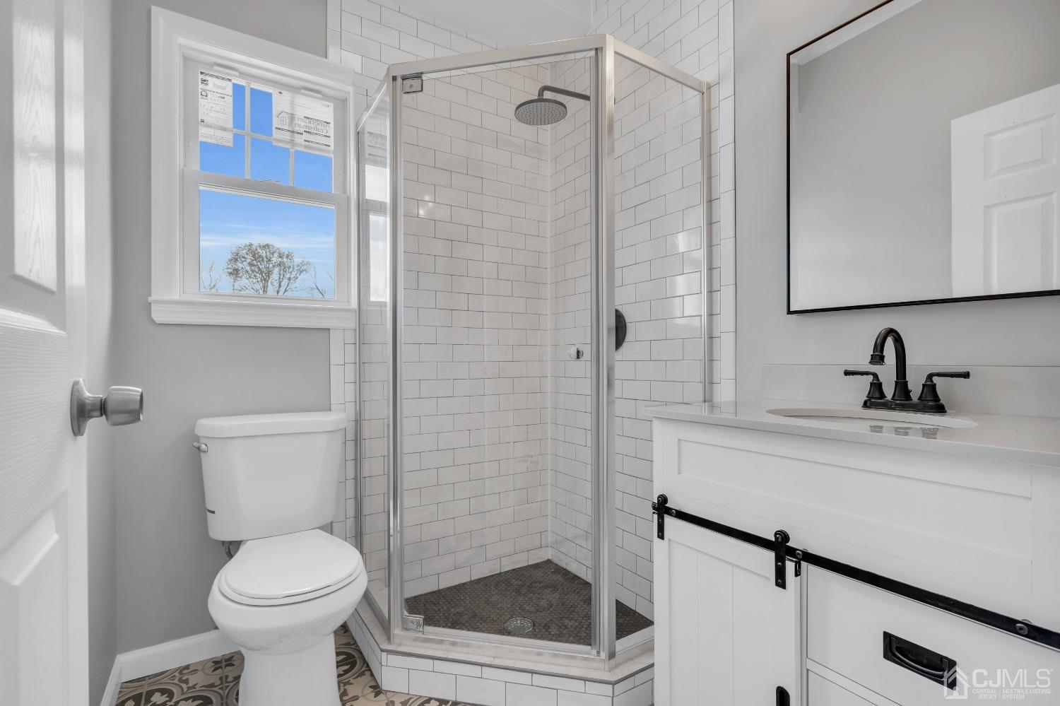 12 Fairfax Road Edison, NJ 08817 - Photo 15 of 30 a bathroom with a sink a toilet and shower