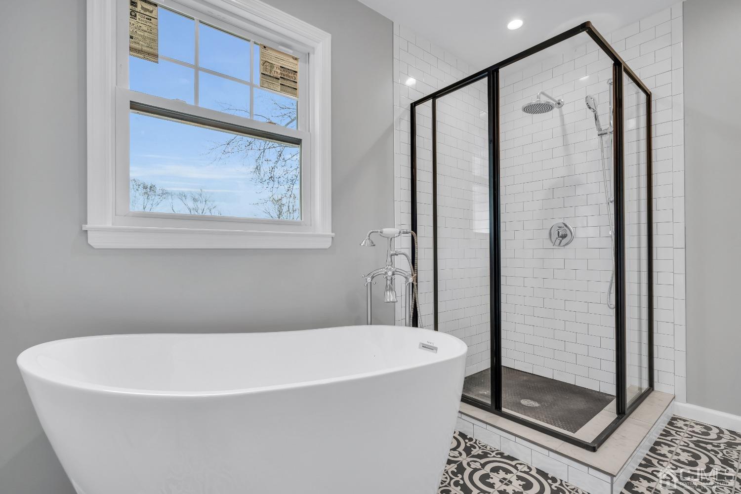 12 Fairfax Road Edison, NJ 08817 - Photo 24 of 30 a white bath tub sitting next to a shower