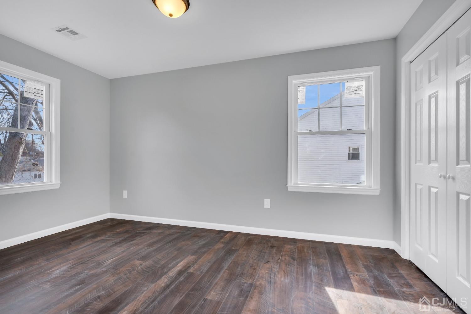 12 Fairfax Road Edison, NJ 08817 - Photo 26 of 30 wooden floor in an empty room with a window