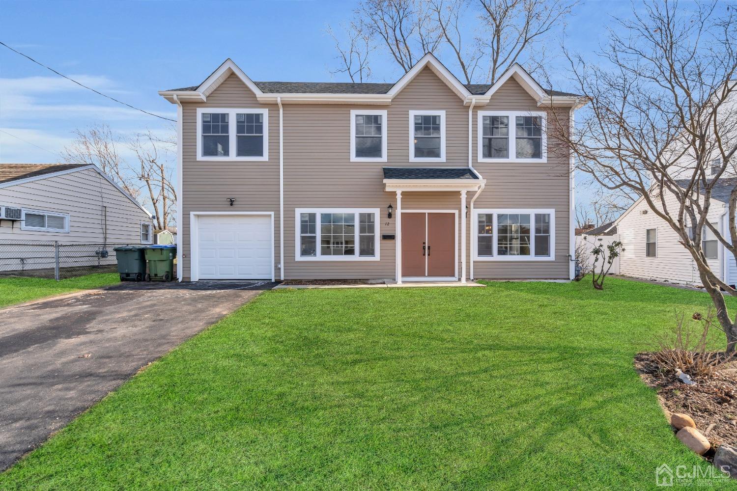 12 Fairfax Road Edison, NJ 08817 - Photo 3 of 30 a front view of a house with a yard
