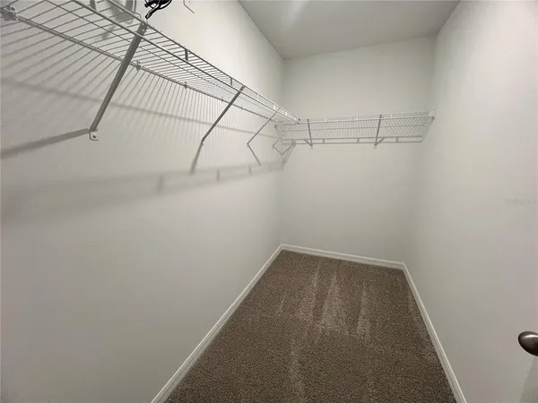 a view of a room with racks on the wall