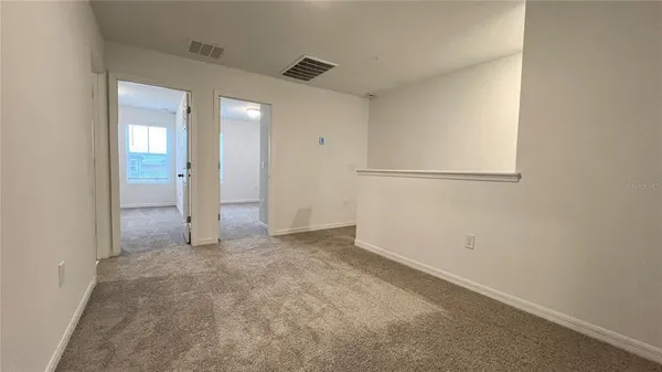 an empty room with closet area