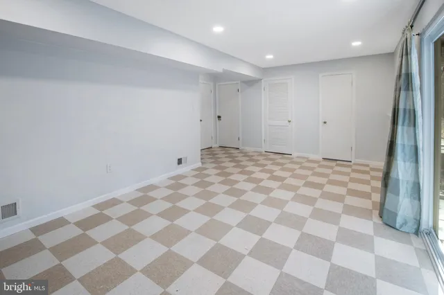 a big room with a black white checkered floor