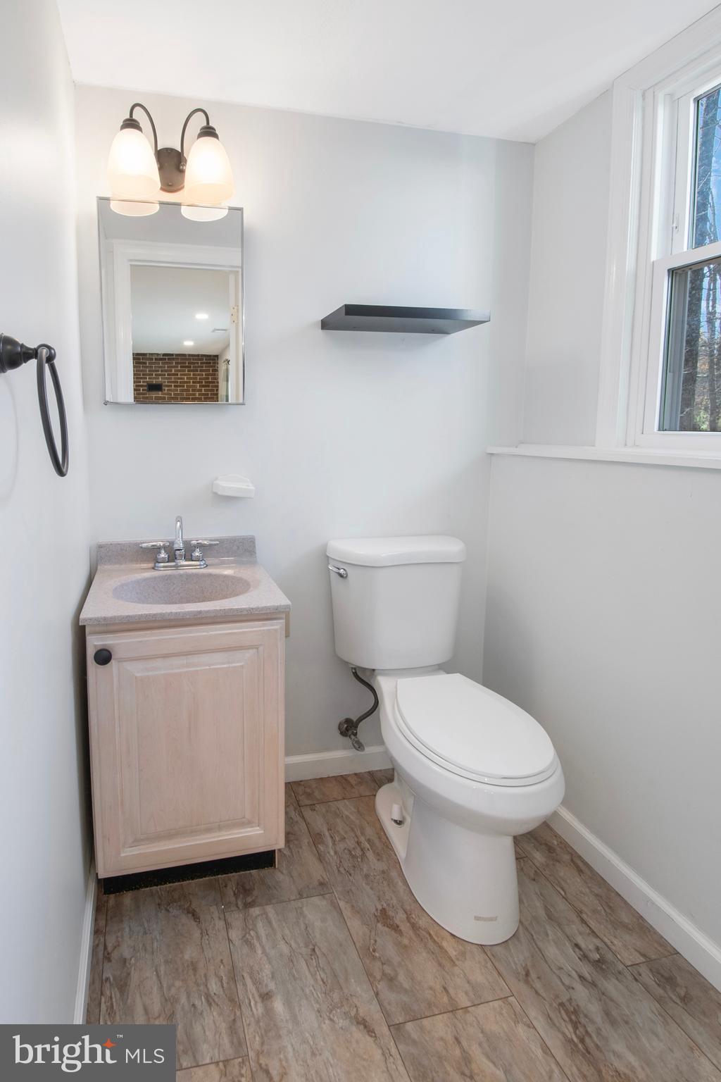 155 Franklin Corner Road Lawrence Township, NJ 08648 - Photo 15 of 29 a white toilet sitting next to a bathroom sink