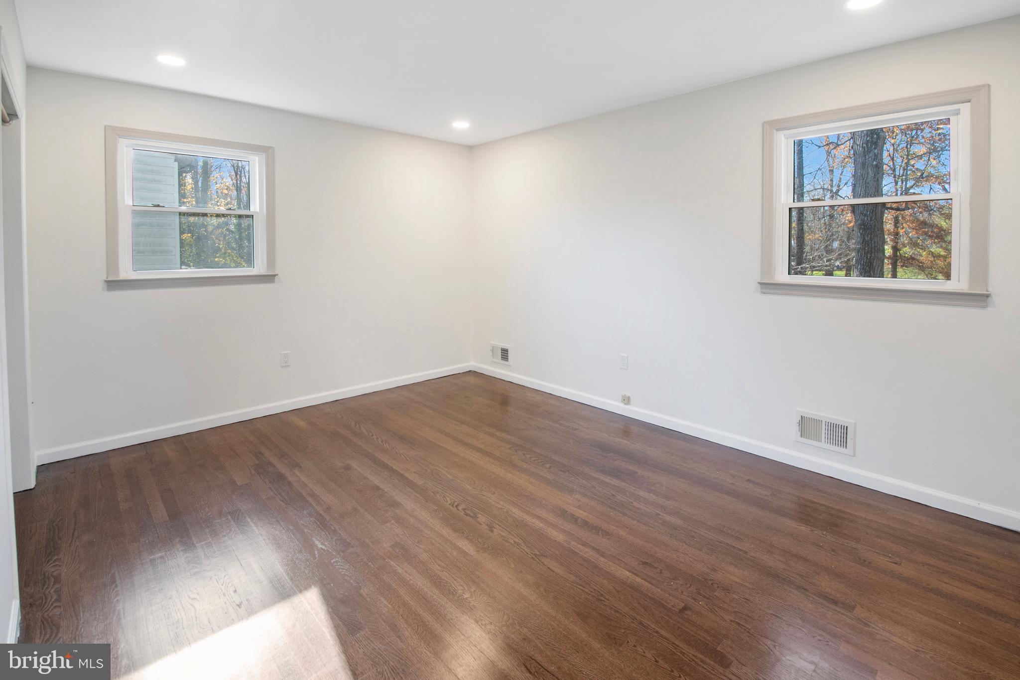155 Franklin Corner Road Lawrence Township, NJ 08648 - Photo 17 of 29 a view of empty room with wooden floor and fan